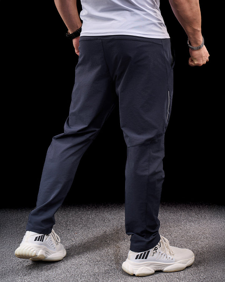 Khaki men's stretch adventure pants, versatile for hiking, travel, & outdoor activewear.
