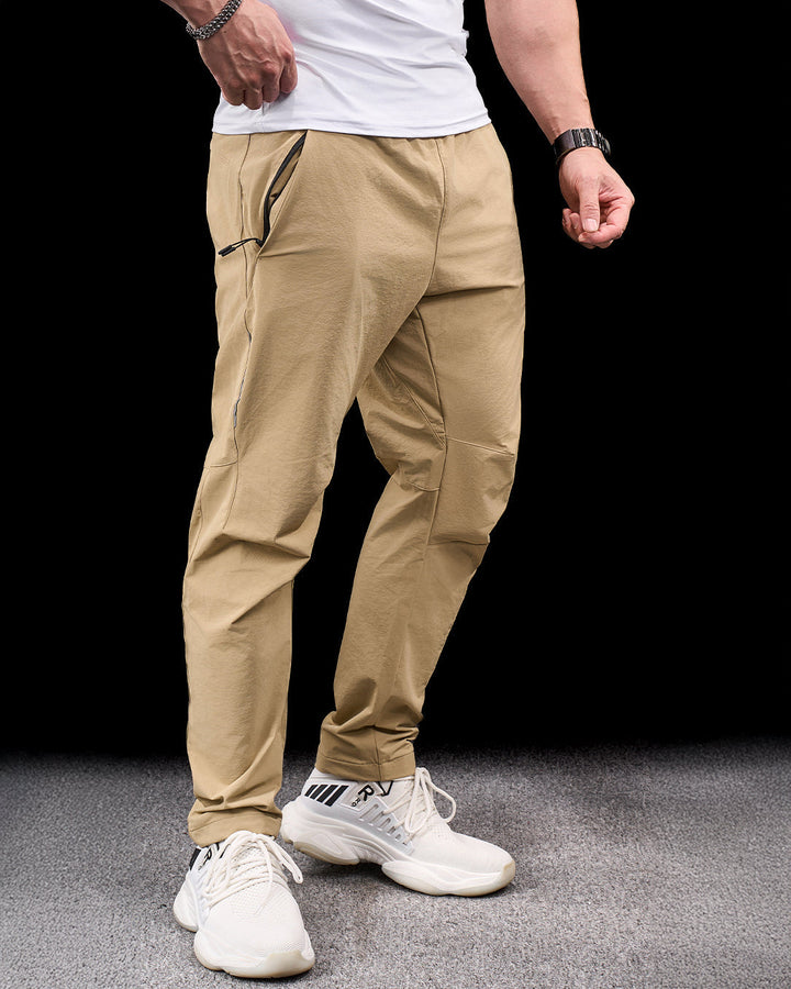 Black men's durable stretch adventure pants for active outdoor hiking & travel.