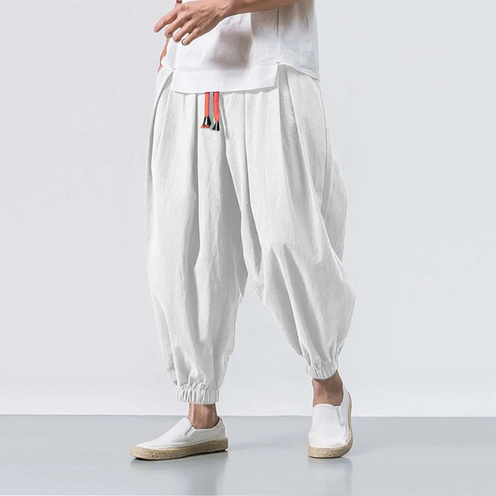 Detail of adjustable drawstring on men's Stride baggy harem joggers, ensuring custom relaxed fit comfort.