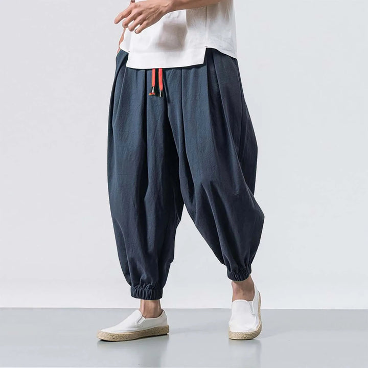 Front view of men's Stride baggy harem joggers, highlighting adjustable drawstring and comfortable relaxed fit.