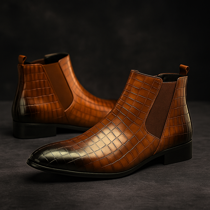 Close-up of men's exotic snakeskin Chelsea boots, highlighting unique texture and premium craftsmanship.