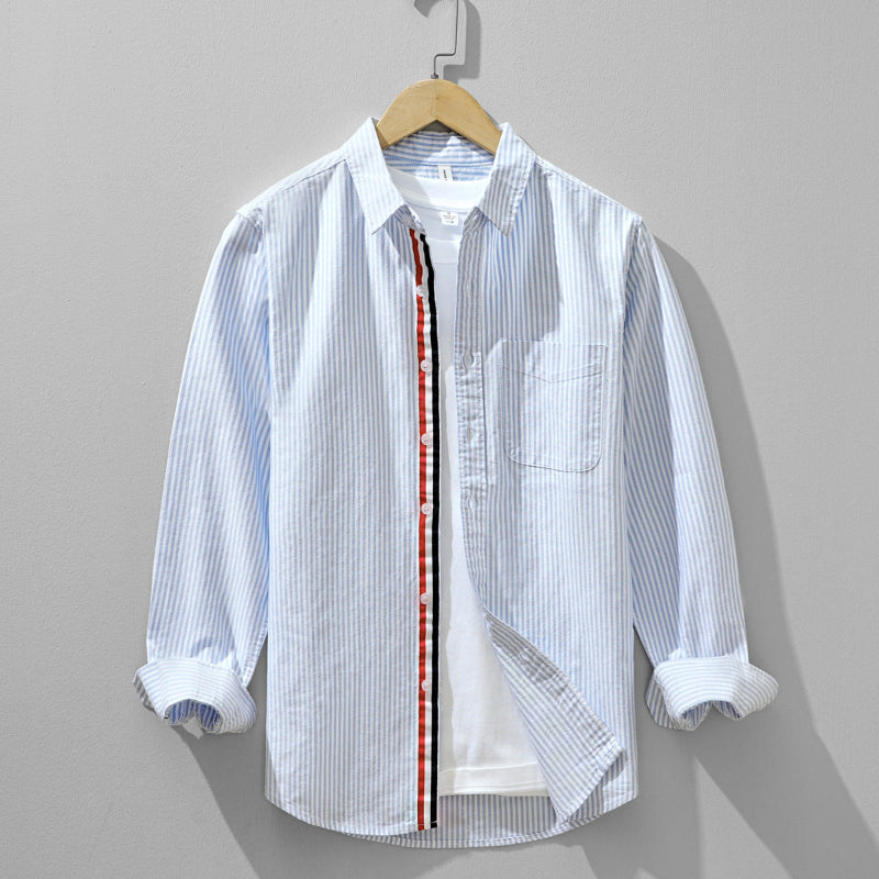 Men's striped long-sleeve button-up shirt for casual or smart casual wear. Versatile apparel top.