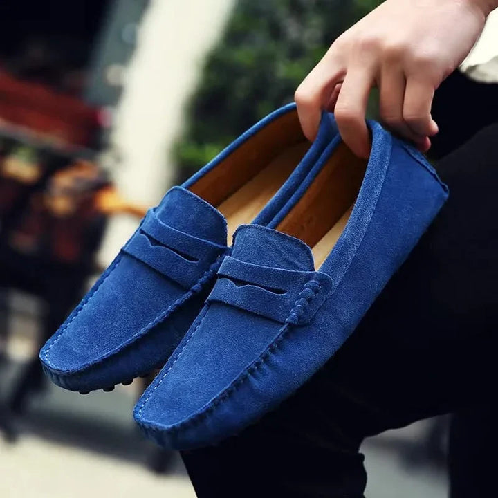 Men's stylish blue slip-on loafers for ultimate comfort and sophistication, perfect for casual or dress.