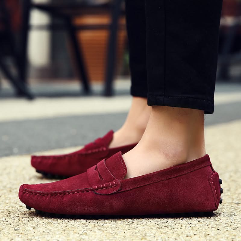Detail of men's slip-on loafers, showcasing comfortable sole and interior for ultimate foot support.