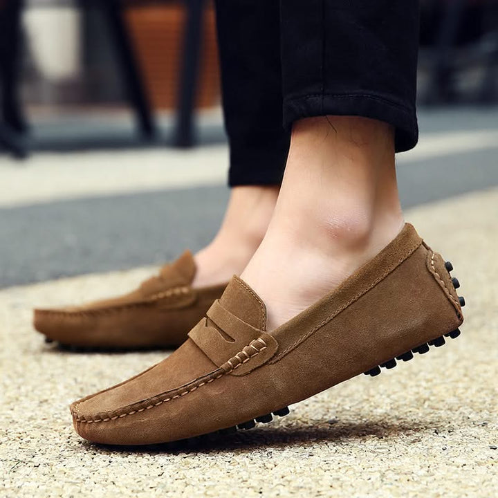 Men's fashionable blue slip-on loafers, a sophisticated and comfortable choice for modern men's footwear.