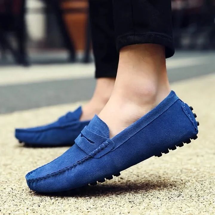 Sophisticated black men's slip-on loafers. Comfortable dress shoes, ideal for formal or stylish casual.