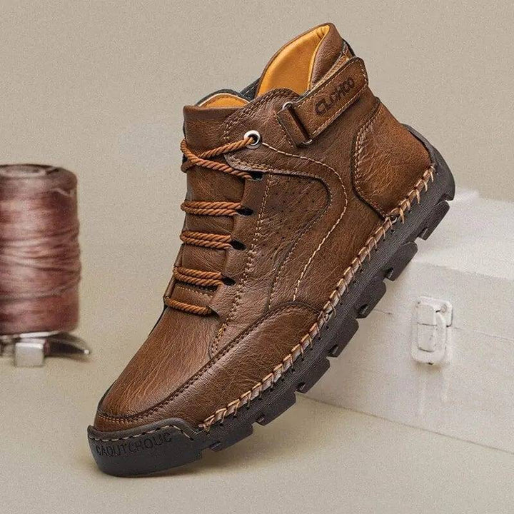 Side view of men's grey PU leather ankle boots, designed with a soft non-slip sole for traction