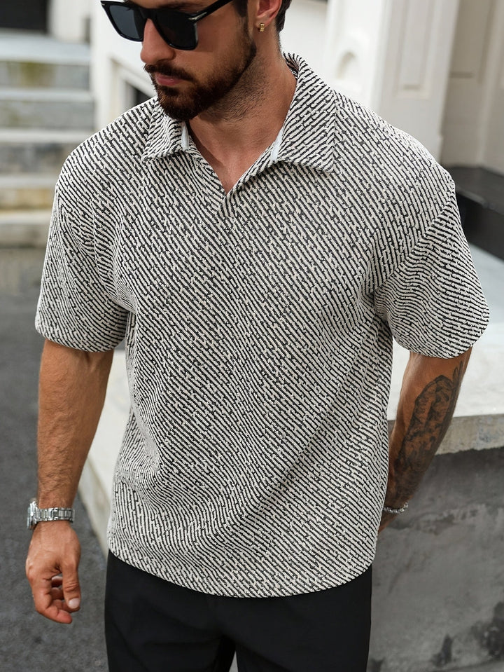 Stylish men's textured Monaco polo shirt, relaxed fit, short sleeve, perfect for modern men's summer fashion.