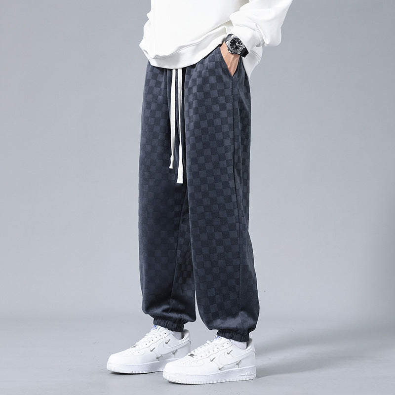 Men's stylish relaxed-fit checkerboard sweatpants, perfect for casual comfort & streetwear fashion.