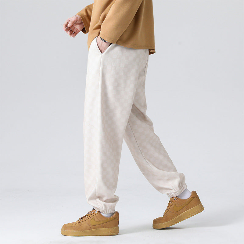 Men's stylish checkerboard streetwear pants, relaxed fit for everyday comfort and modern fashion.