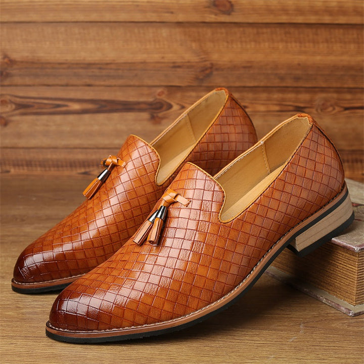 Durable men's woven leather tassel loafers, a classic choice for sophisticated style.