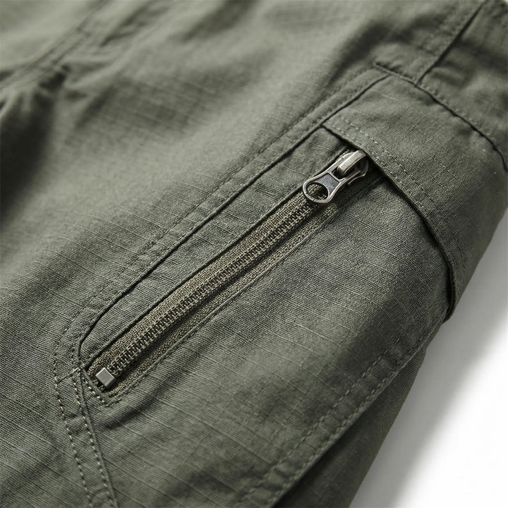 Comfort fit men's tactical pants, 9 utility pockets. Durable outdoor wear for hiking, work, and daily adventure.