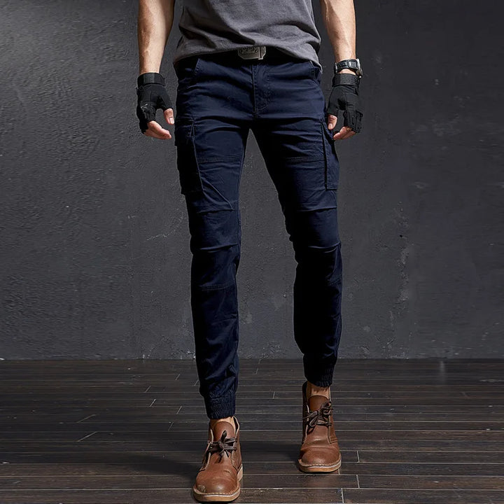 Men's durable tactical cargo pants with multi-pockets, tapered fit, cuffed ankle. Outdoor adventure gear.