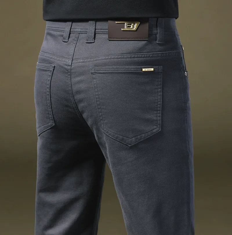 Close-up of premium cotton texture on men's tailored trousers, showcasing refined quality and fit.