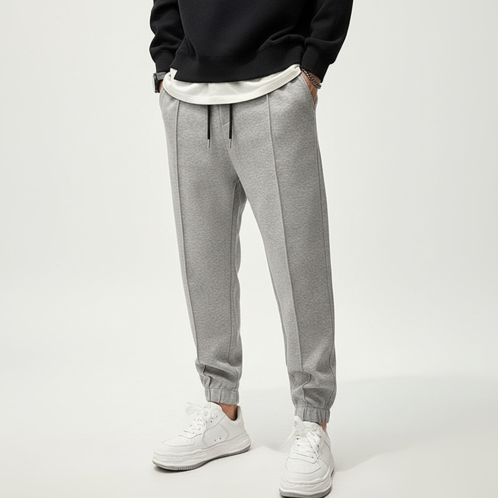 Performance men's sportswear pants, Tanner model, with comfortable elastic waist for active men's training.