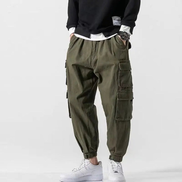 Utility men's cargo pants, tapered fit & elastic cuffs for modern casual fashion.