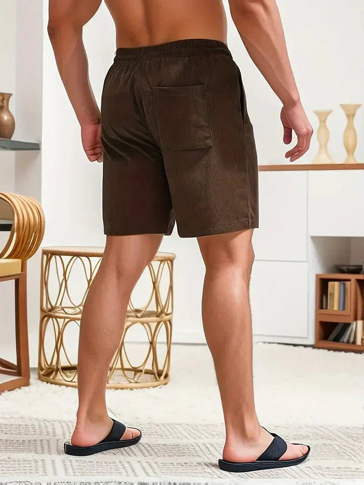 Functional men's textured drawstring shorts. Stylish, comfortable, relaxed fit for casual summer wear.