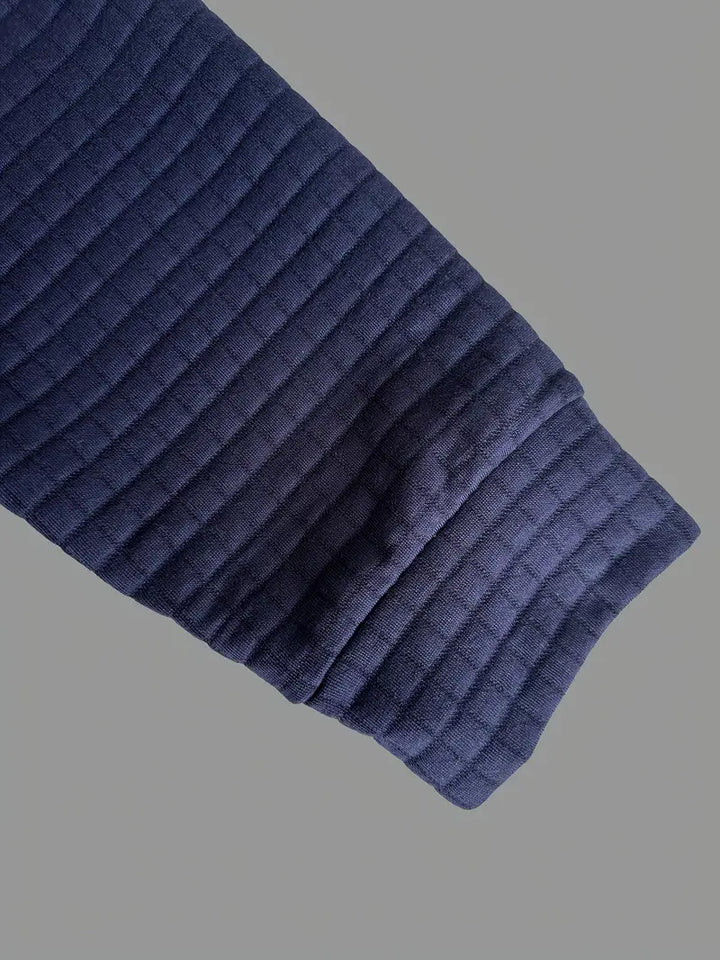 Fine-textured men's long sleeve polo with a neat button placket, great for casual to smart-casual looks.