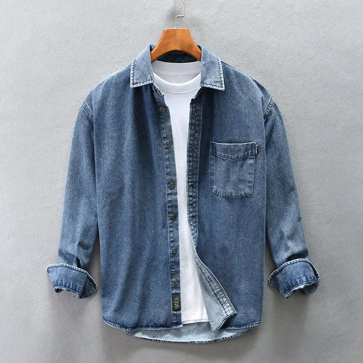 Blue men's casual button-up shirt. Classic long-sleeve top for versatile everyday wear and timeless fashion.