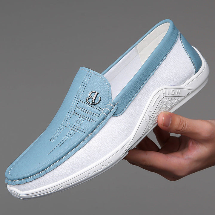 Modern men's two-tone slip-on loafers, smart casual comfort footwear for daily wear.