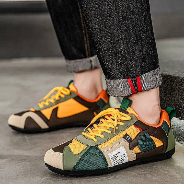 Pair of Men's Urban Street Sneakers, side view, featuring patchwork design and lace-up
