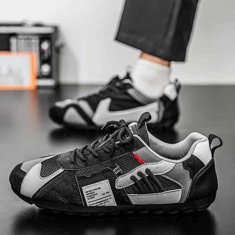 Detail of patchwork design on men's streetwear shoes, highlighting unique urban style