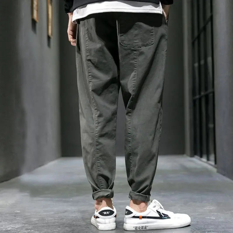 Drawstring men's tapered joggers in a breathable cotton blend, offering comfort for casual pants & athletic wear.