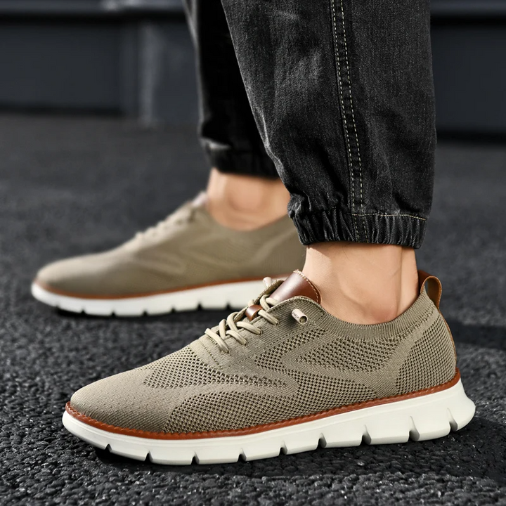 Men's UrbanFlex everyday sneakers in black, offering lightweight and memory foam support.