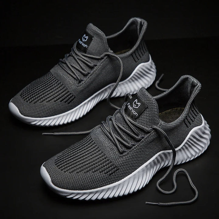 Supportive Men's Velocity performance trainers, ensuring a secure & comfortable stride.