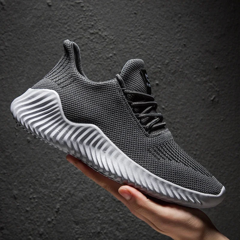 Modern Men's Velocity athletic shoes, blending sleek style with performance features.