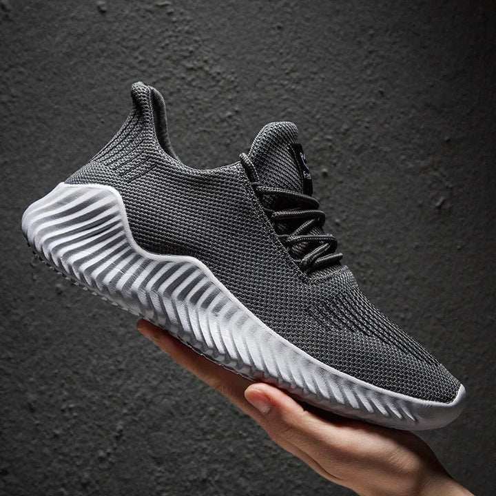 Modern Men's Velocity athletic shoes, blending sleek style with performance features.