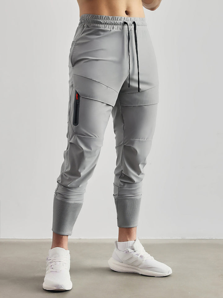 Men's versatile cargo joggers, black, tapered fit, perfect for athleisure & everyday comfort.