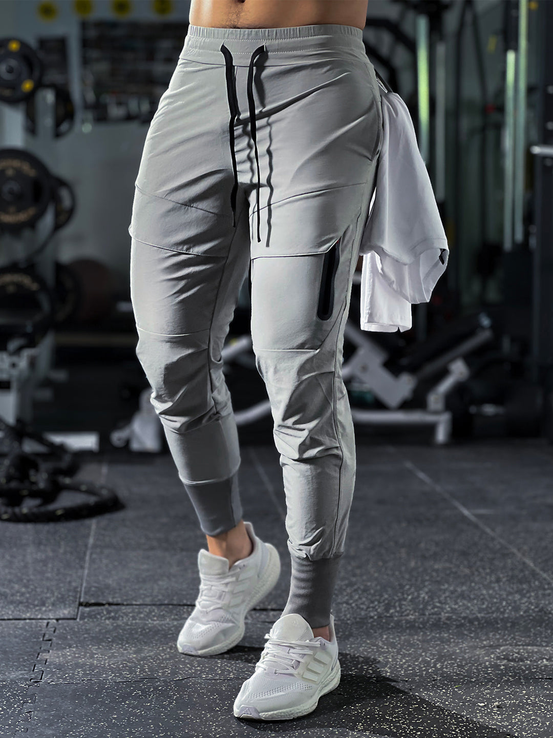 Back view of men's comfortable cargo joggers, black, highlighting seams and relaxed fit.