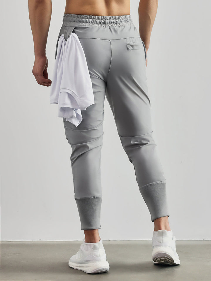 Tapered fit men's cargo joggers, performance activewear, versatile for athleisure & streetwear.