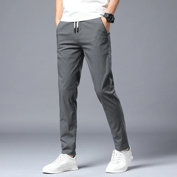 Modern men's slim fit dress pants with stretch, designed for all-day comfort and a sharp, versatile appearance.