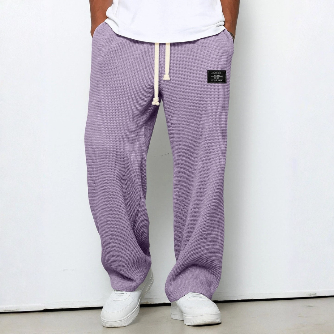 Versatile men's comfort trousers, crafted from waffle knit fabric, great for home or casual outings.