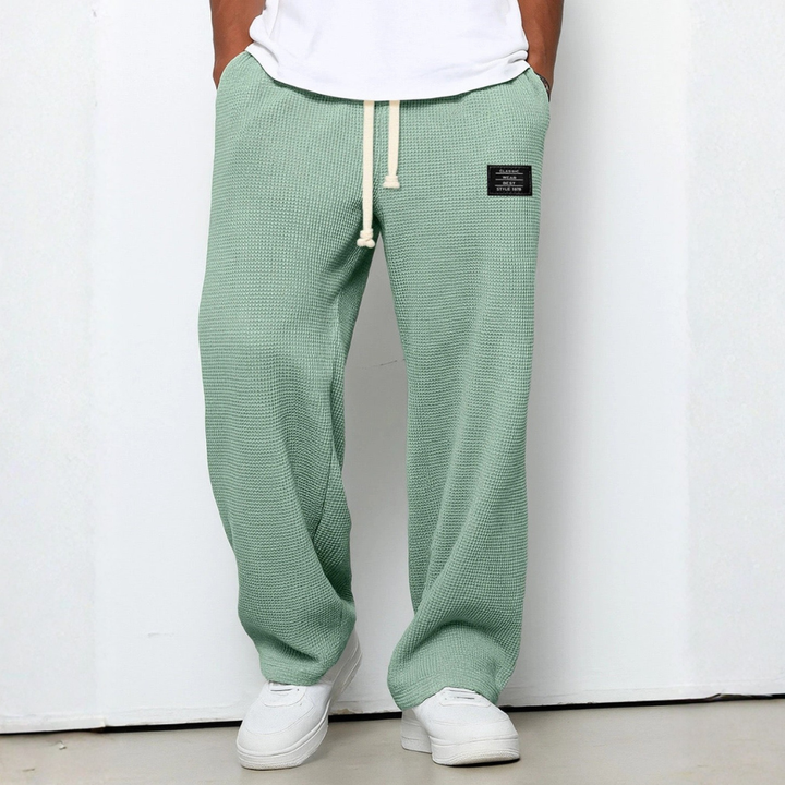 Stylish men's waffle knit loungewear, knit pants designed with a relaxed, comfortable fit.