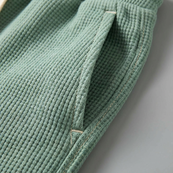 Ultra-comfortable men's waffle knit trousers, complete with a drawstring waist for a perfect fit.