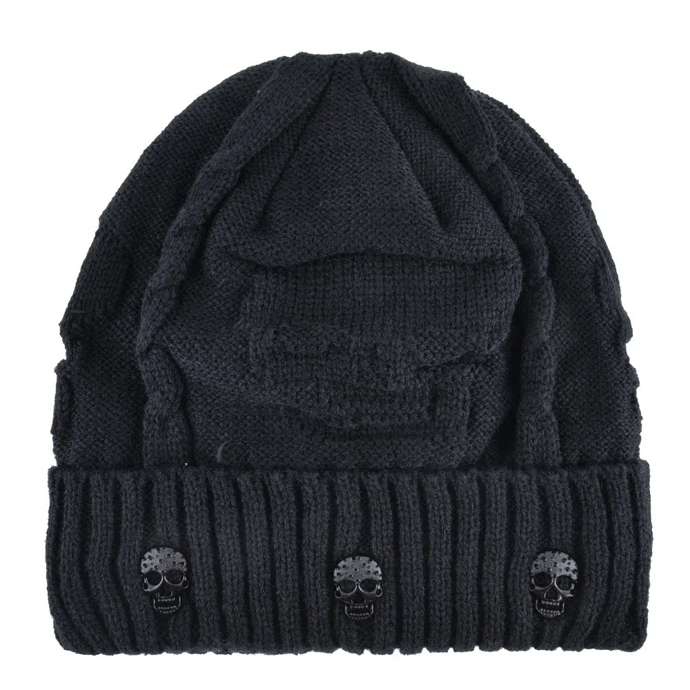 Black men's warm knit skull cap beanie, an edgy winter hat with striking metallic accents. Stylish men's accessory.