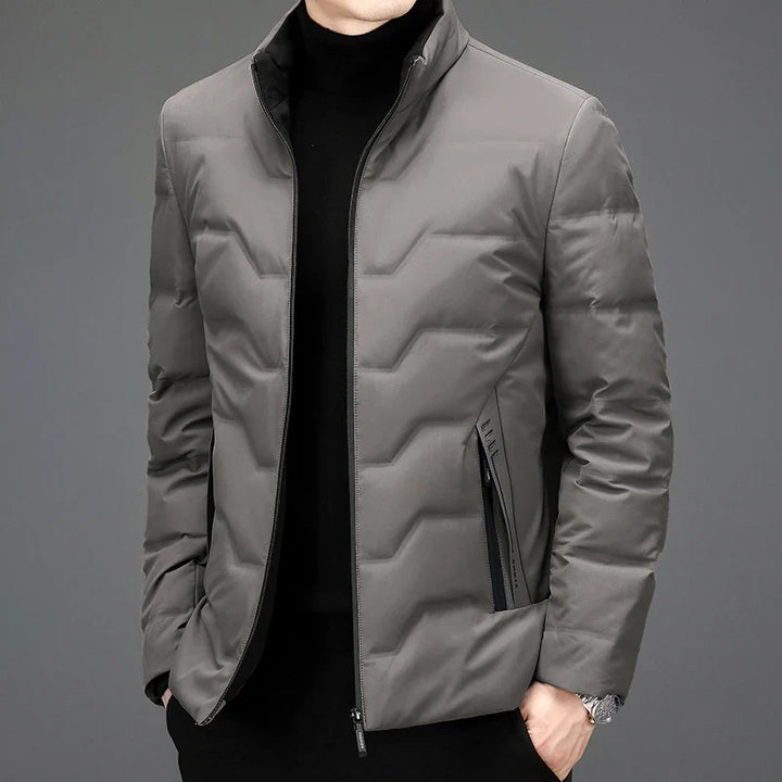 Lightweight men's winter quilted puffer jacket, offering warmth and style for everyday wear. Essential cold weather outerwear.