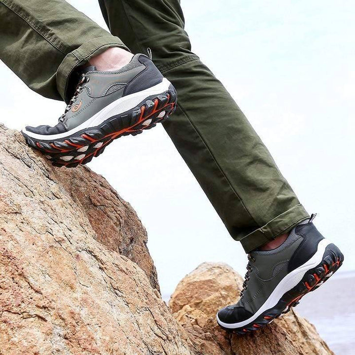 Men's waterproof hiking shoes, black with blue accents, durable sole, laces, outdoor trekking footwear