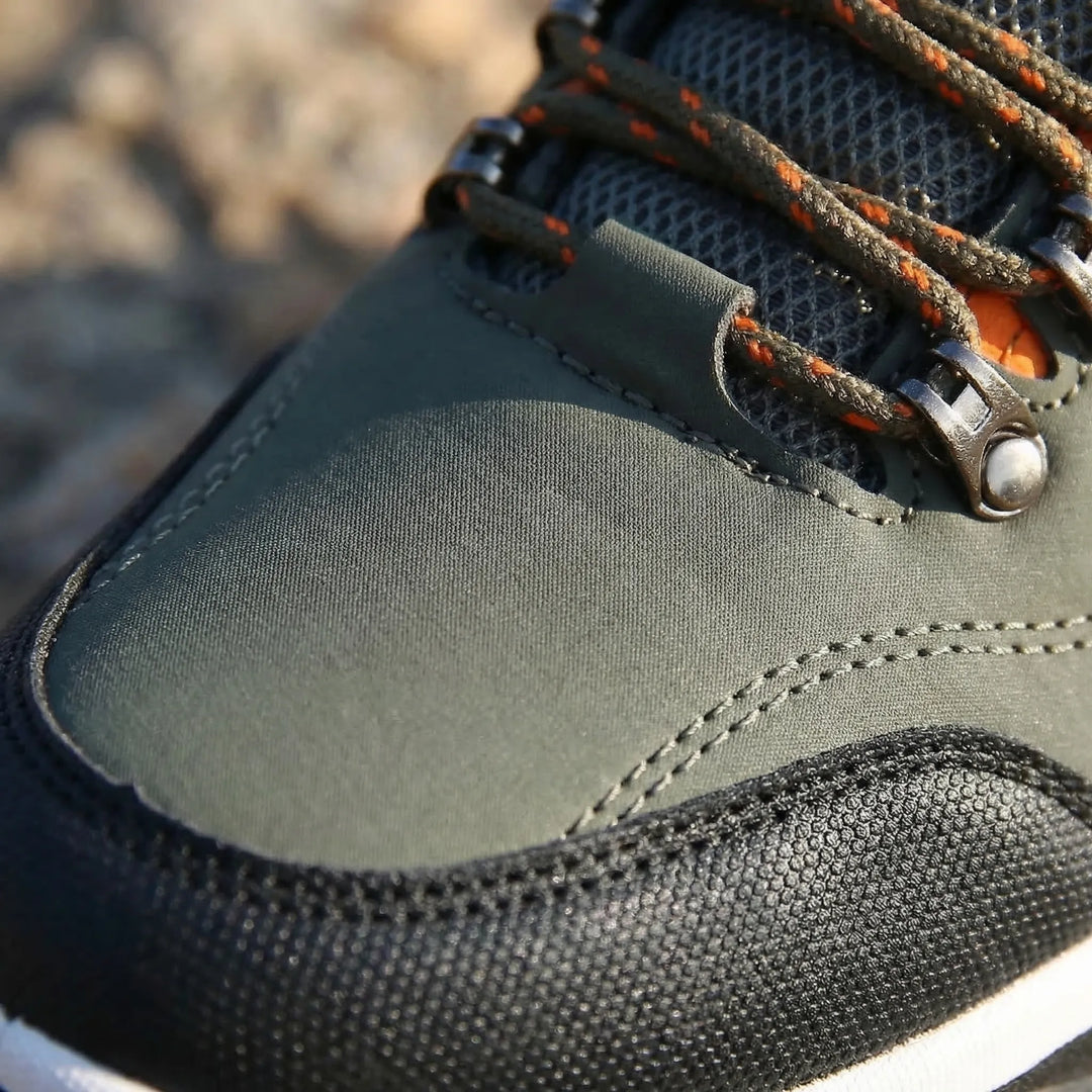 Aggressive sole detail of men's waterproof hiking shoes, offering slip-resistant grip for all-terrain outdoor trails.