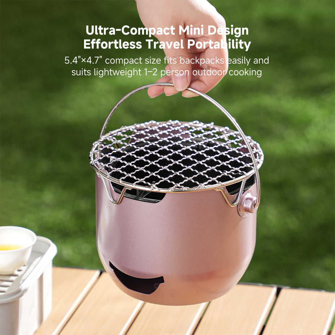 Mini camping charcoal grill made of cast iron, perfect for a portable barbecue experience.