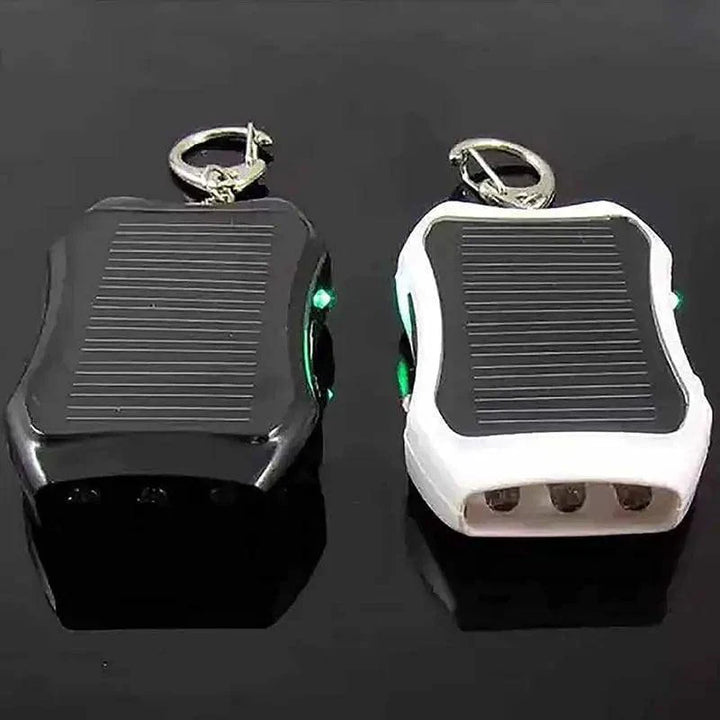 Compact solar keychain flashlight with integrated 1500mAh power bank, ideal for outdoor adventures.