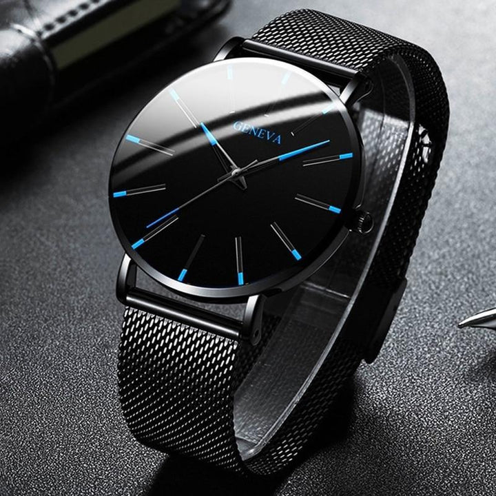 Sleek men's minimalist watch with a black strap, featuring subtle blue accents for a modern yet classic timepiece.