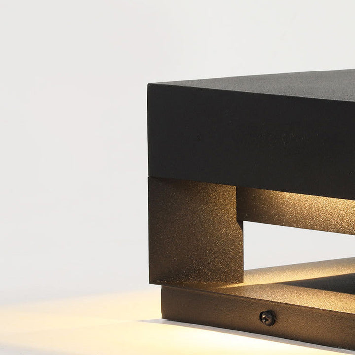 Warm white LED minimalist square outdoor wall light, LumaBloc. Modern, weatherproof exterior garden lamp.