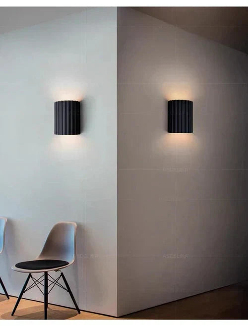 Stylish home decor wall lamp with artistic wave pattern. Modern LED lighting, perfect for ambient light.