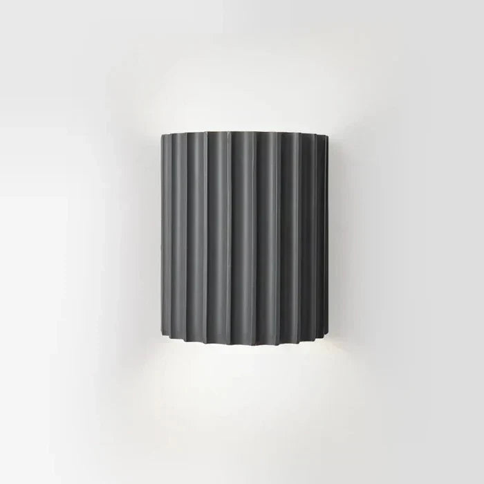 Designer wall light with a modern artistic wave aesthetic. Contemporary LED lamp, ideal for home accent lighting.