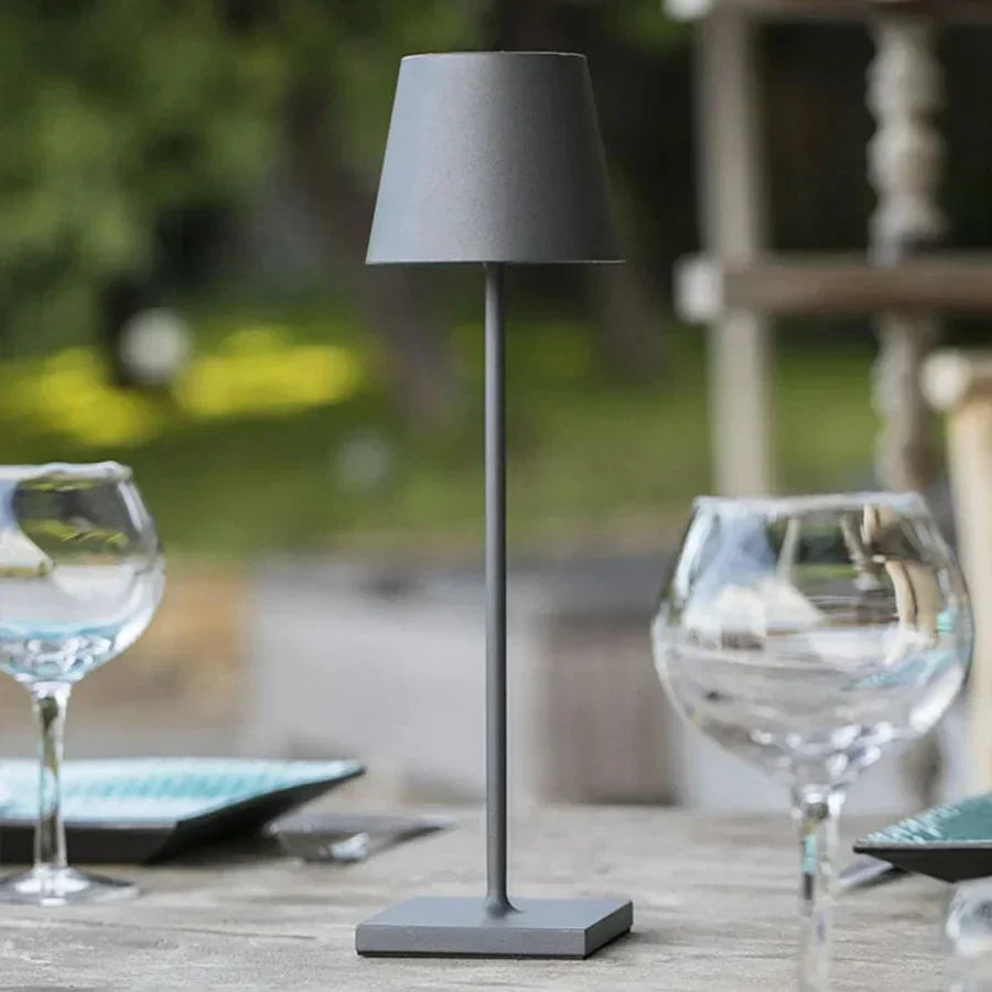 Sleek aluminum modern table lamp, dimmable LED, touch control. Ideal for office desk or home lighting.