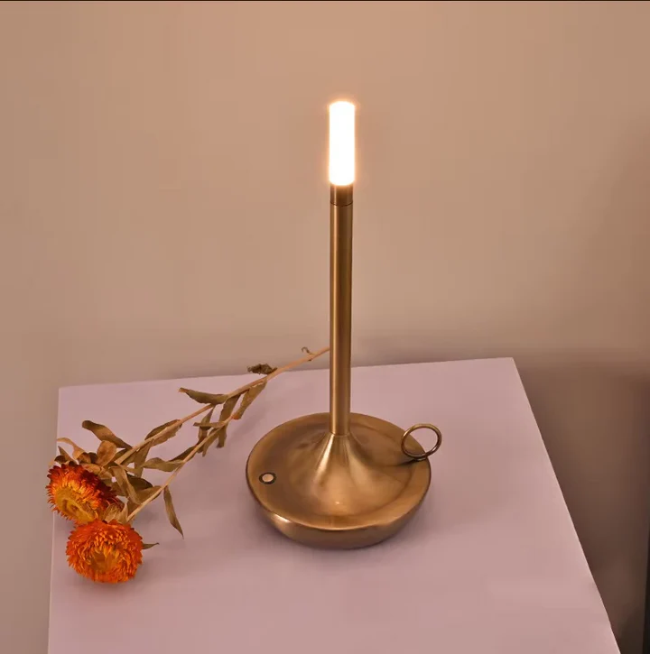 Portable rechargeable candle lamp with dimmable LED. Ideal wireless bedside or camping light, modern home decor.